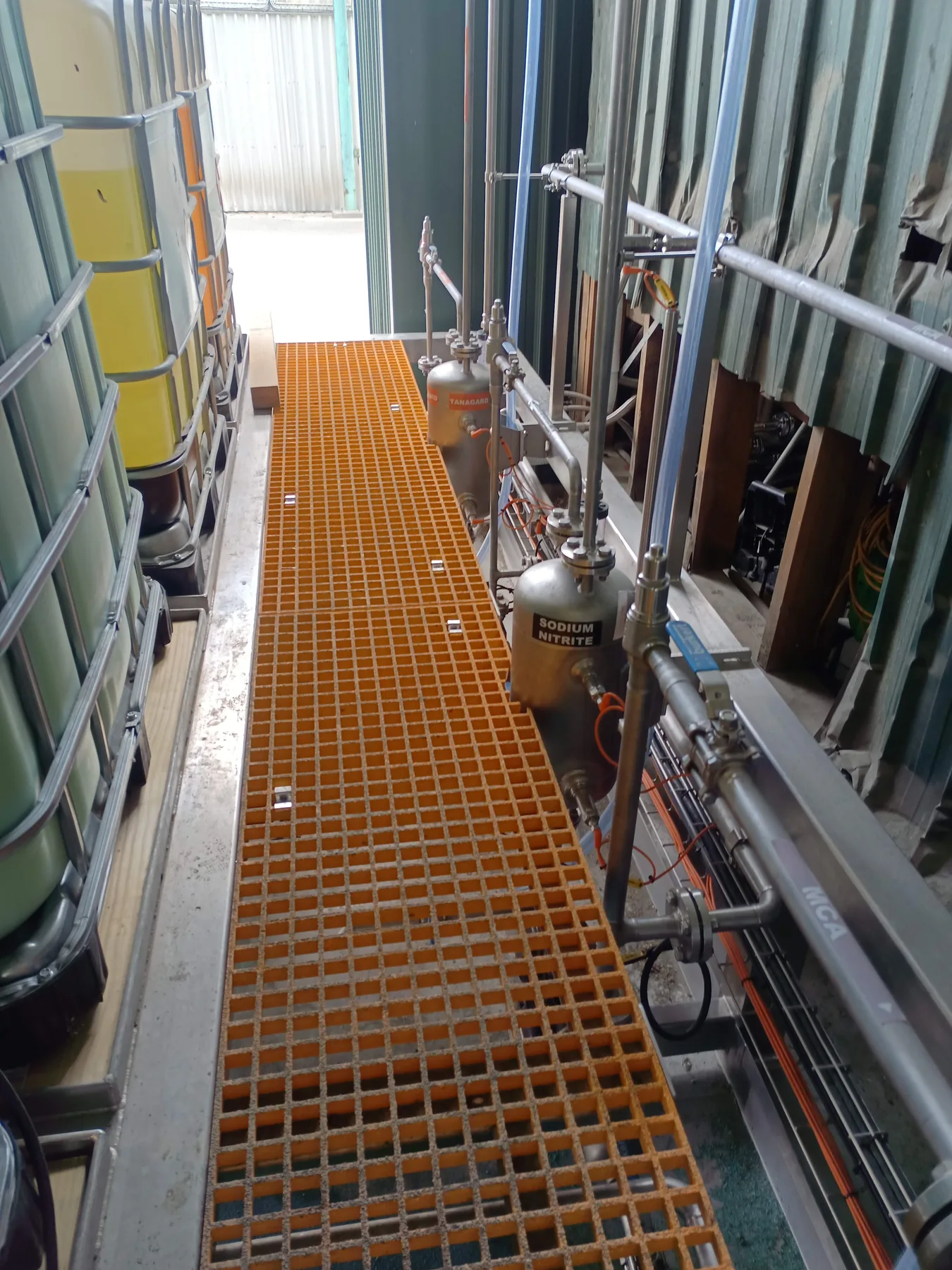 Chemical dosing vessels, stainless-steel pipework and access platform