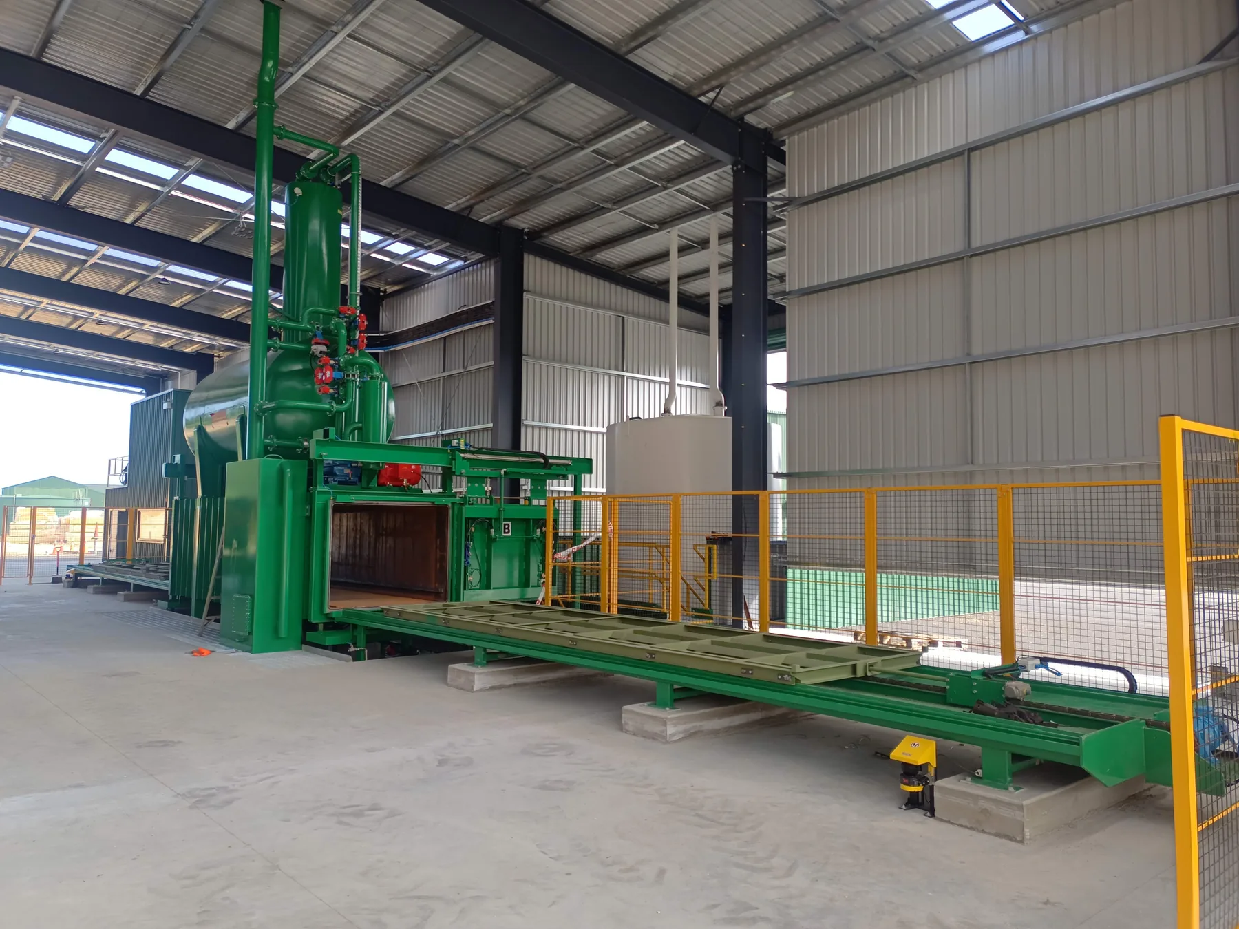 OneFortyOne LOSP timber treatment vessel and conveyor