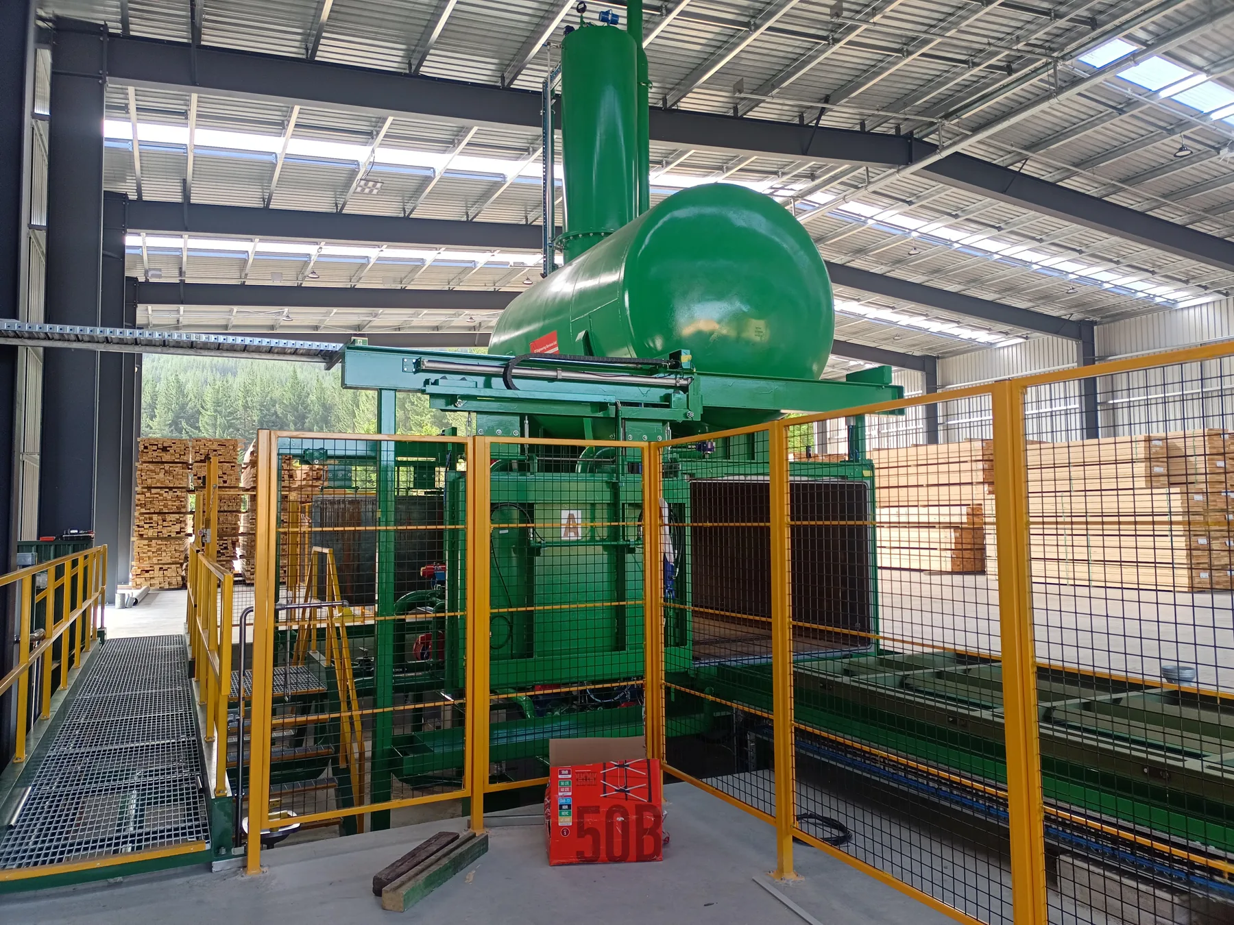 OneFortyOne LOSP treatment vessel, safety guarding and timber packs